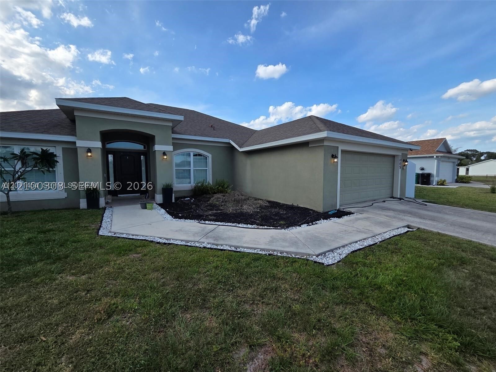 Property Photo:  1005 SW Bay State Rd  FL 34953 