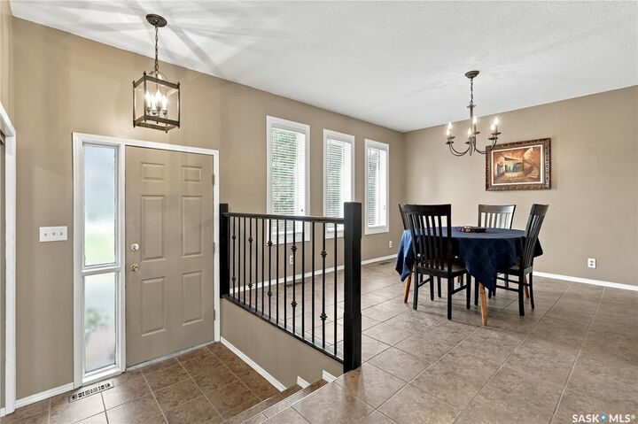 Property Photo:  65 Meadow Road  SK S4L 5B1 