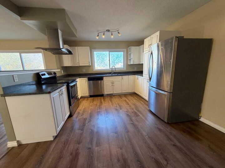 Property Photo: 11320 97 Street B AB T8V 3M9