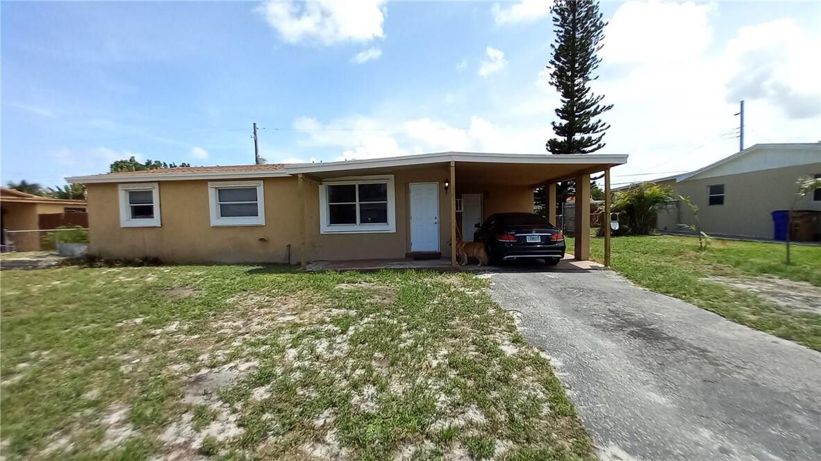 Property Photo:  330 NW 38th Street  FL 33064 