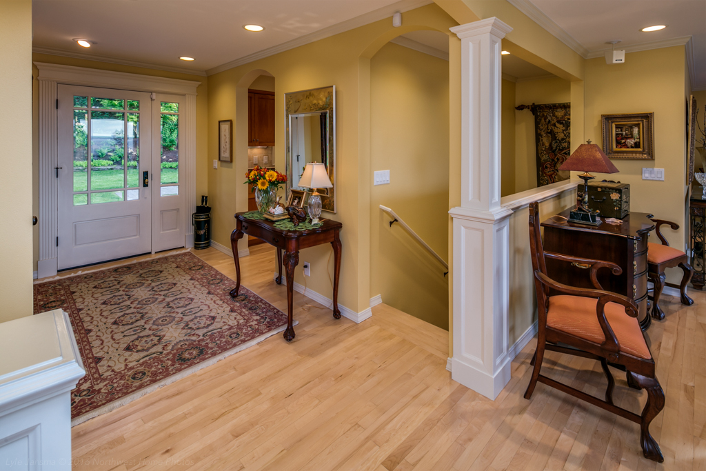 Property Photo: Front entry from the living room with kitchen to the right at arch and basement stairway 233 Middlefield Rd  WA 98225 